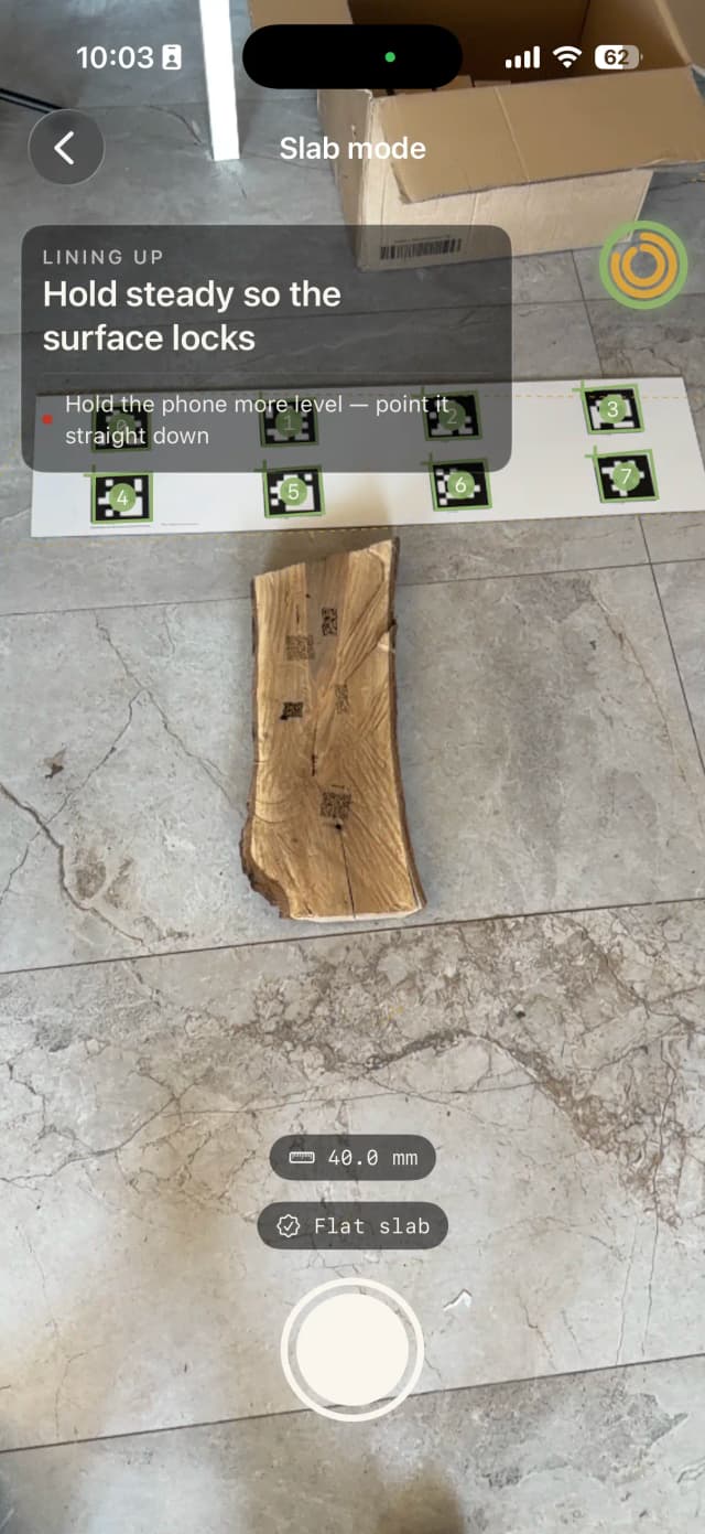 Live AR capture of a slab on the floor with AprilTag markers and on-screen guidance